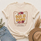 God Is Good T-Shirt — Floral Christian Faith Tee ("my attitude is a work in progress")