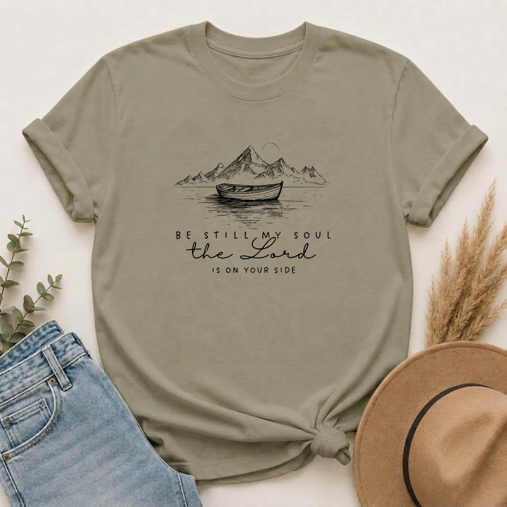 T-Shirt – “Be Still My Soul, the Lord Is On Your Side” Boat & Mountains Faith Tee