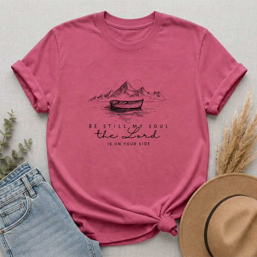 T-Shirt – “Be Still My Soul, the Lord Is On Your Side” Boat & Mountains Faith Tee